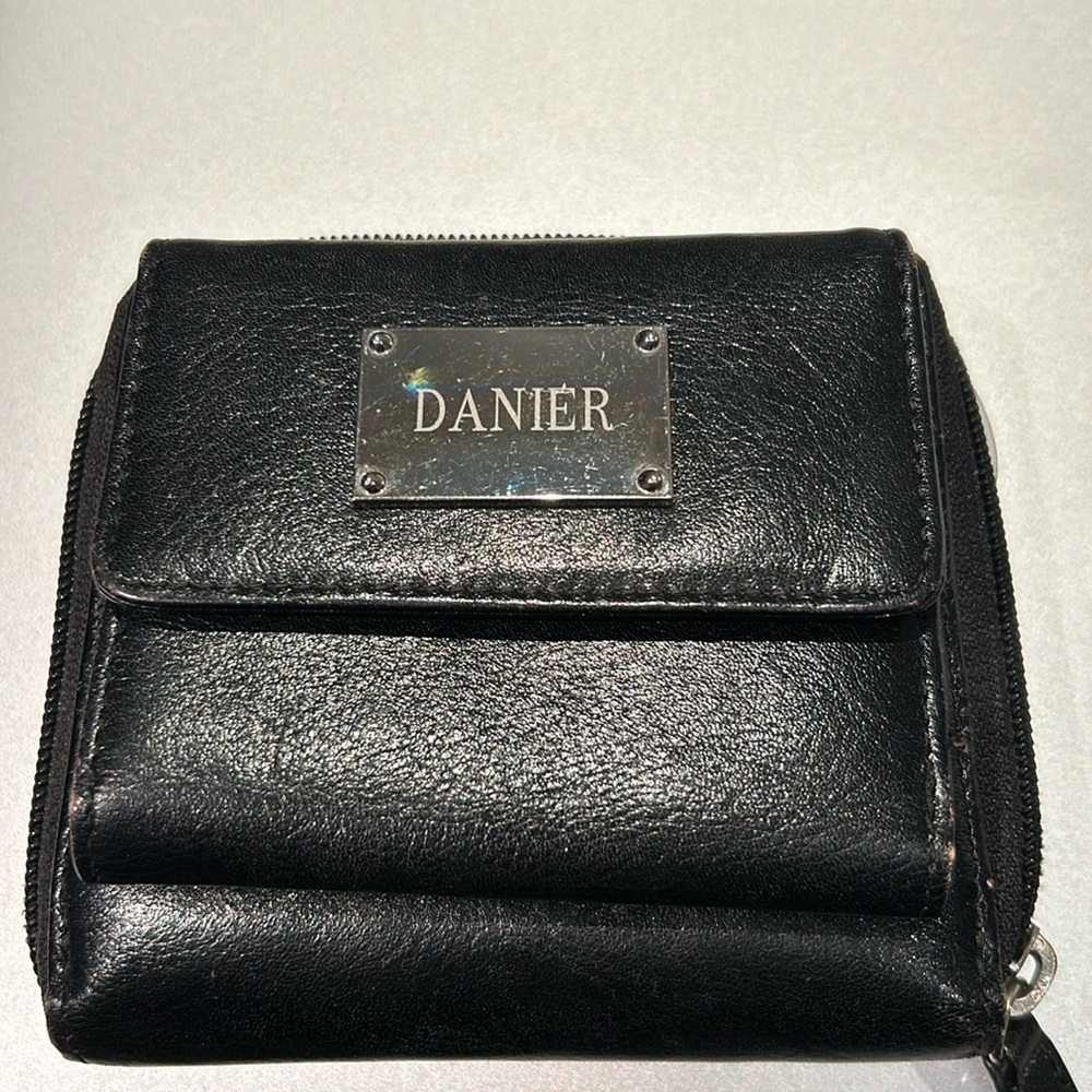 Danier- leather wallet. Silver hardware, wrapped around zipper plus card pockets